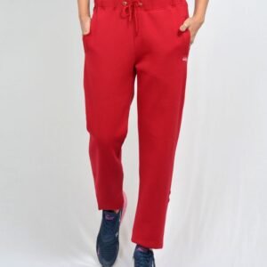 Close-up of a woman's torso in red sweatpants, showcasing sporty style.